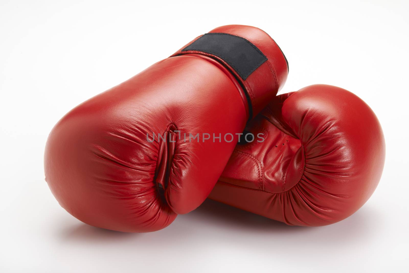 Pair of red boxing gloves isolated on white background