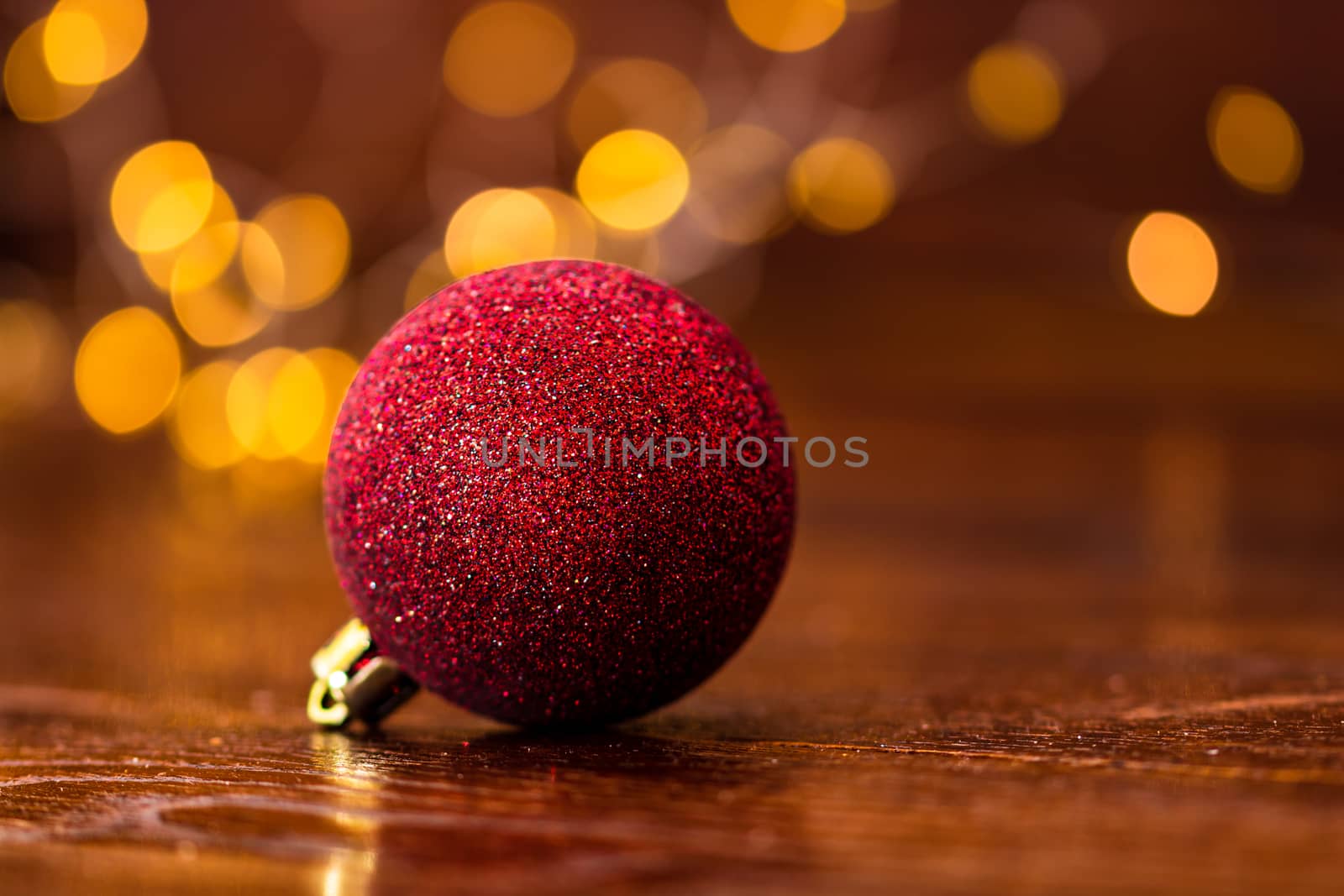 Colorful Christmas ball isolated on blurred and shiny background by vladispas