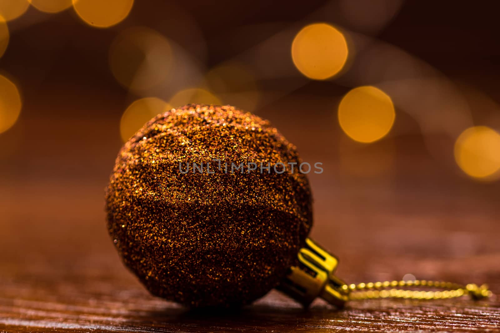 Colorful Christmas ball isolated on blurred and shiny background by vladispas