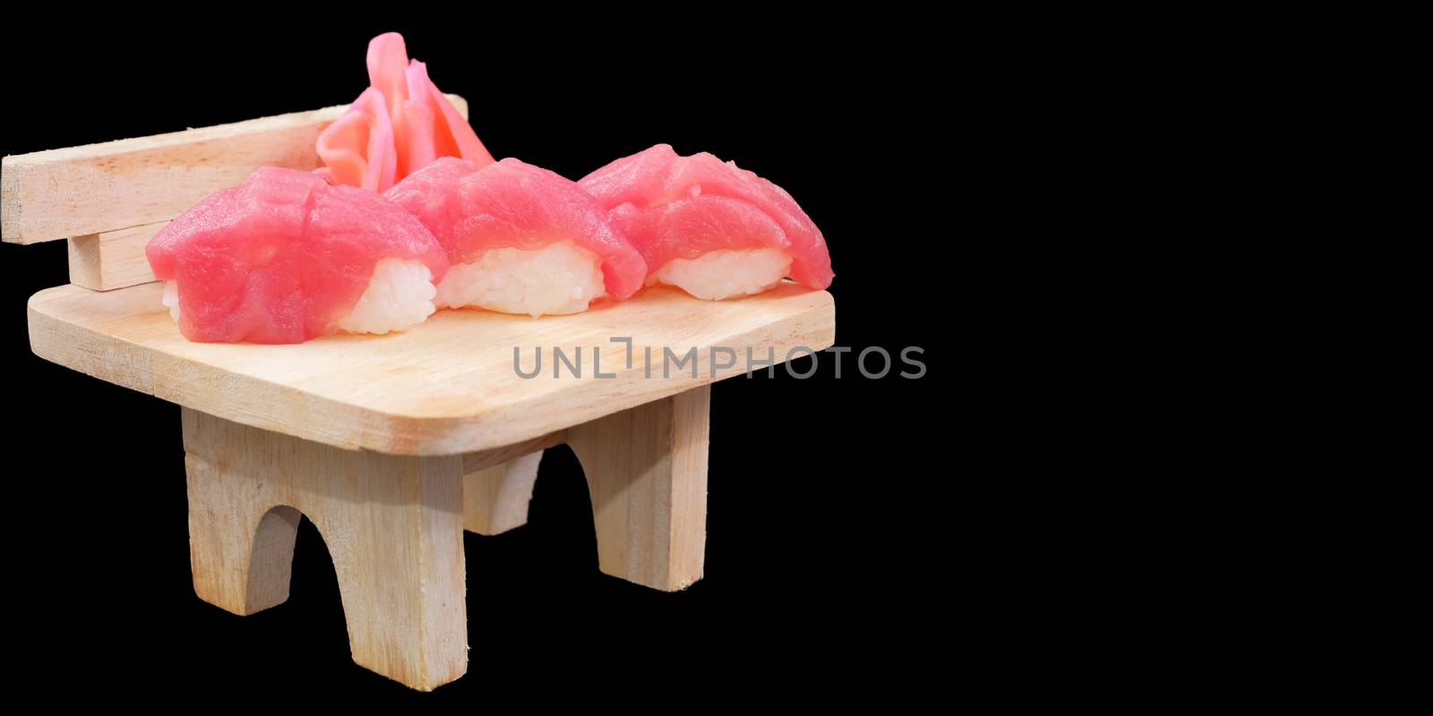 Japanese Cuisine - Salmon Sushi Roll on wood plate in blackbackg by Surasak