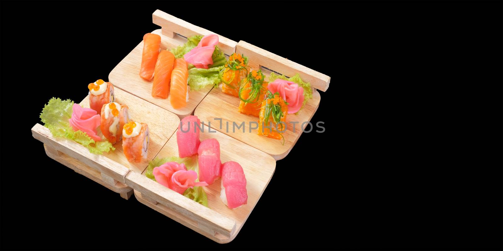 Japanese Cuisine - Sushi Roll on wood plate in black background and space for text