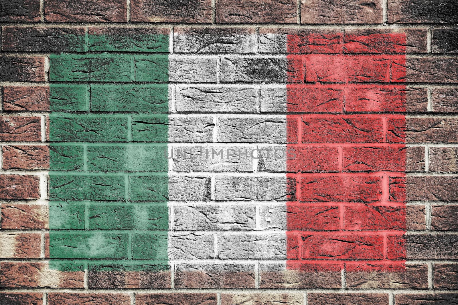 An Italy flag painted on brick wall background