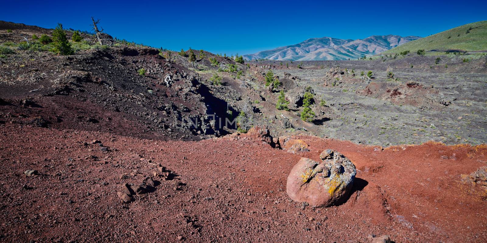 Boulder on a ridge at Craters of the Moon National Park. by patrickstock