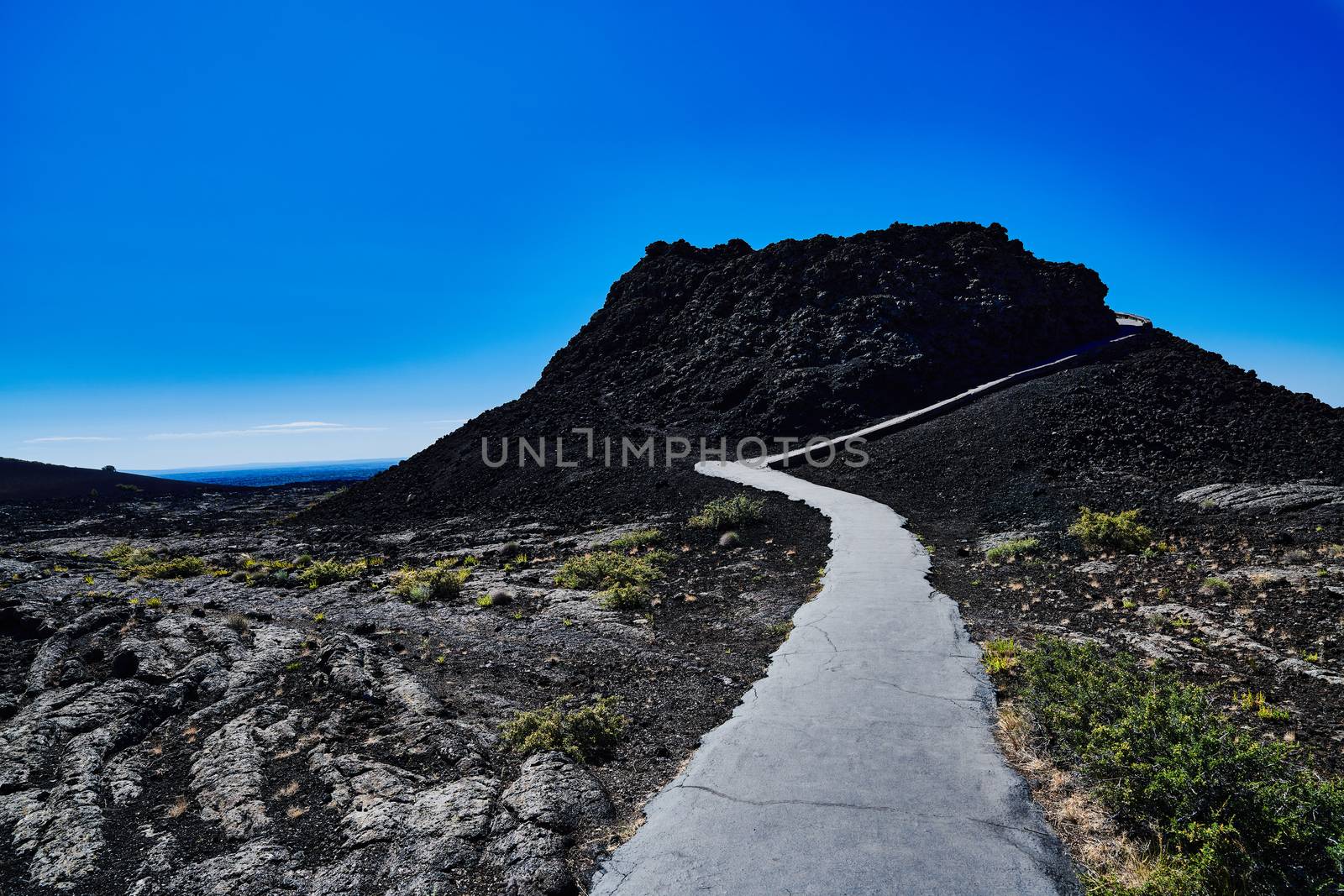 Splatter Cone with hiking path at Craters of the Moon National P by patrickstock