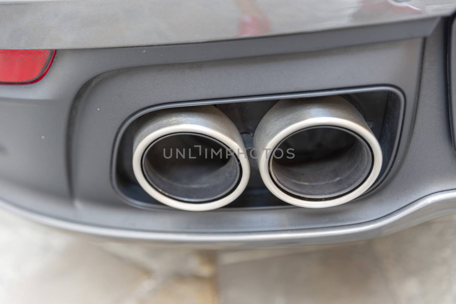 a cylindrical double sports car exhaust