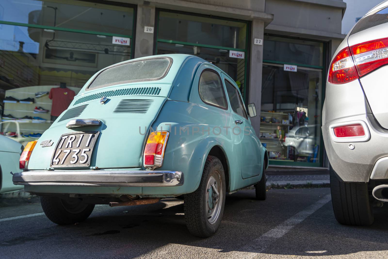 terni,italy august 28 2020:detail of a light blue vintage fiat 500