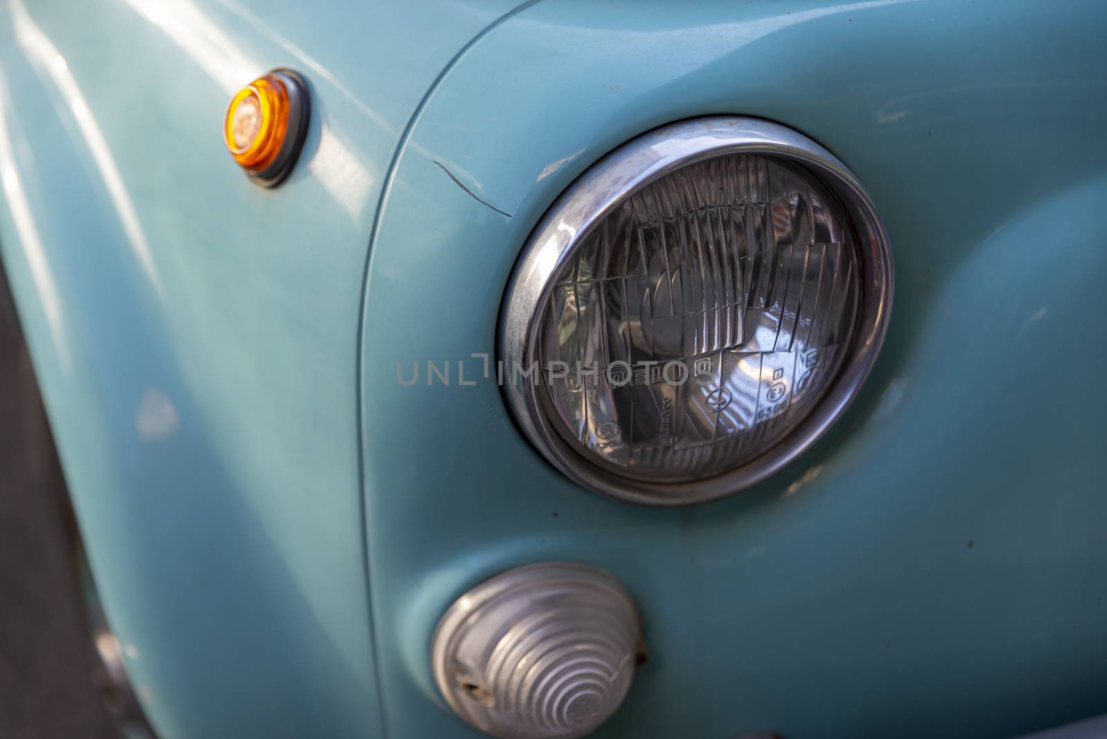 terni,italy august 28 2020:detail of a light blue vintage fiat 500