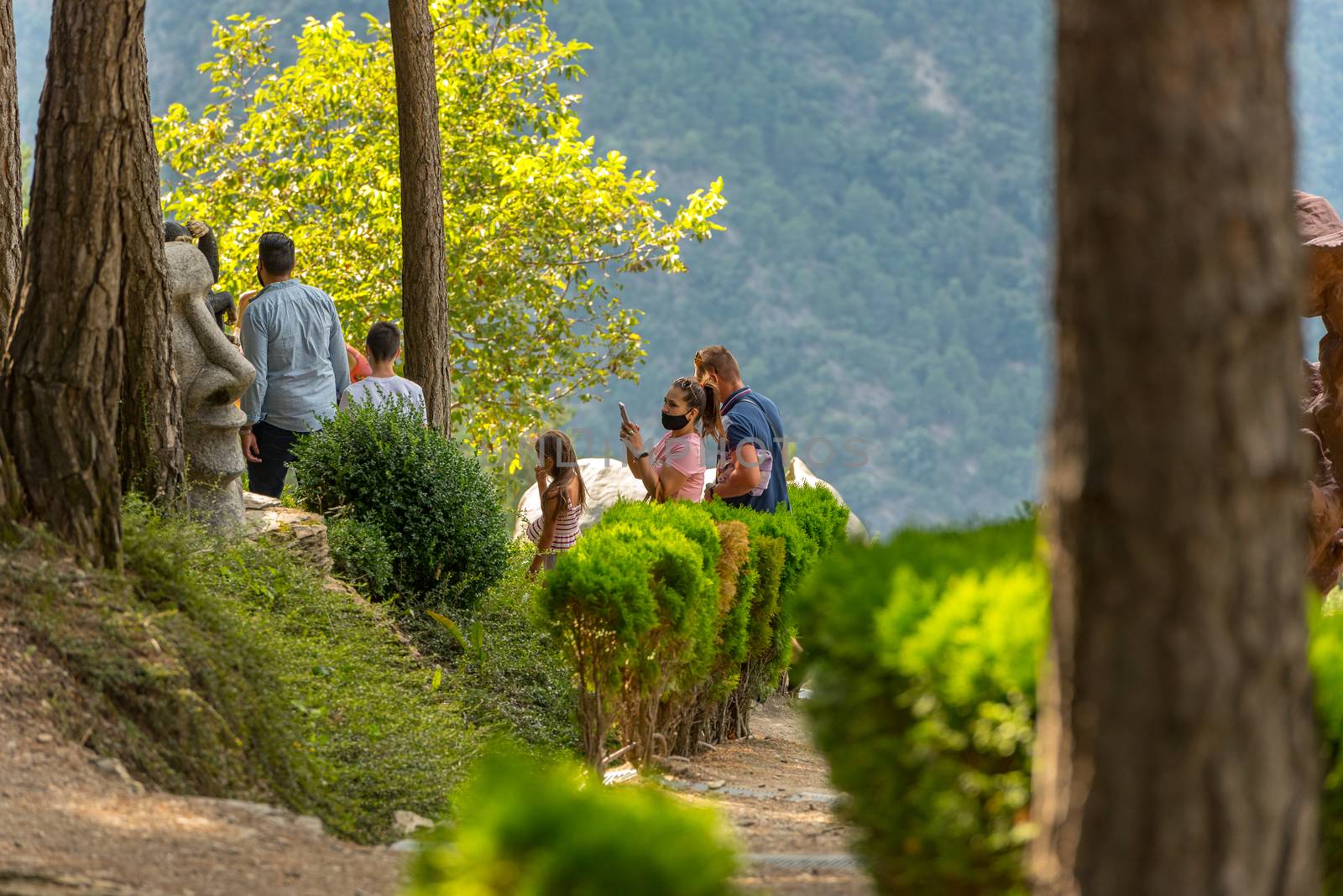 Family enjoying of Sculptures in Jardins de Juberri in summer 20 by martinscphoto