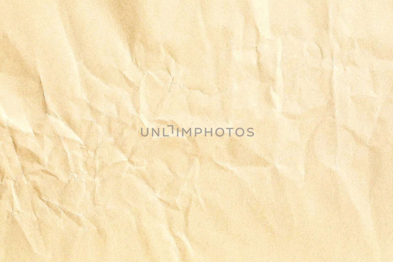 Old pale yellow crumpled paper background texture