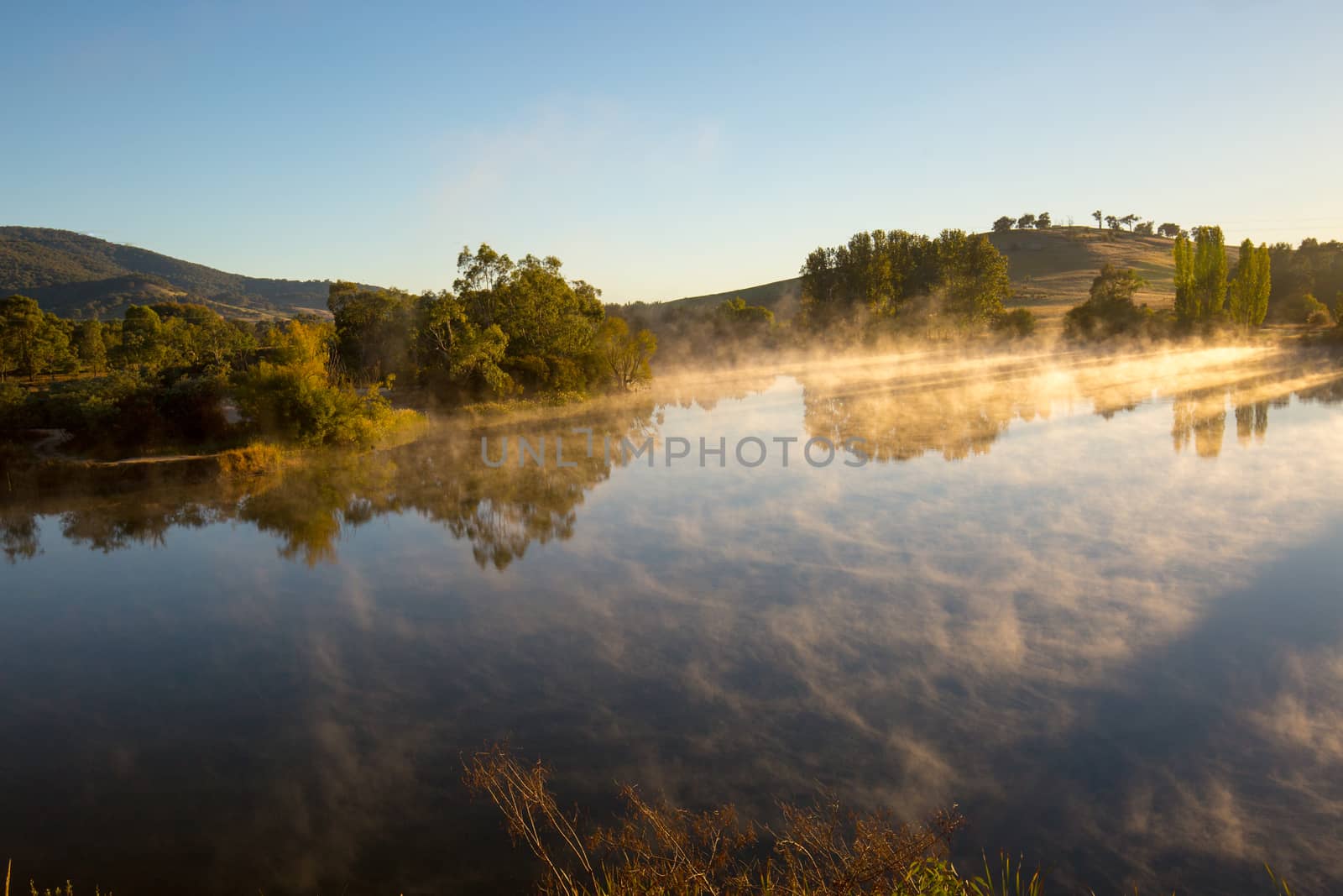 Classic Australian landscape and misty lake on a cold morning in Allans Flat, near Yackandandah in Victoria Australia