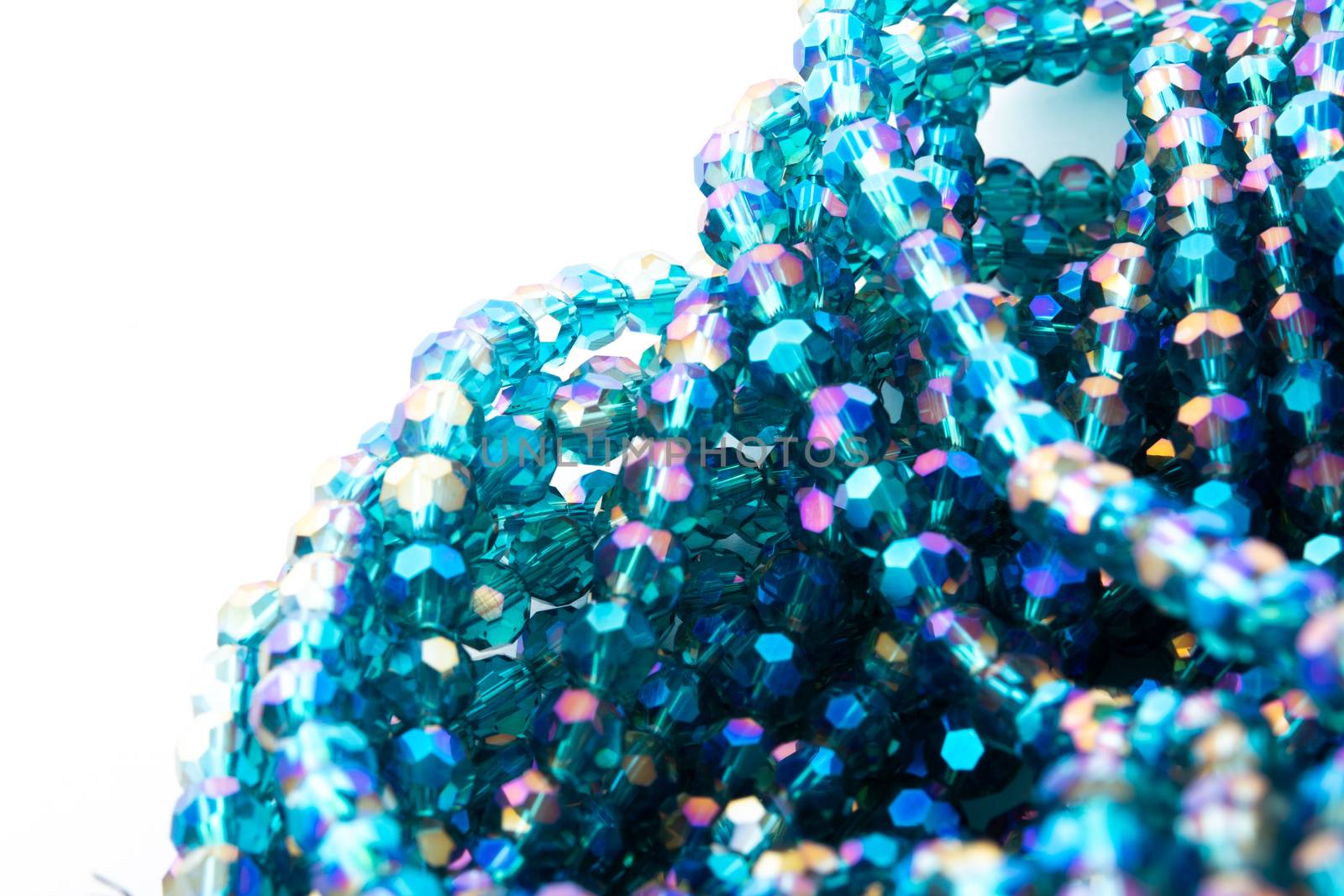 Beautiful emerald Glass Sparkle Crystal Isoalted Beads on white background. Use for diy beaded jewelry. Space for text