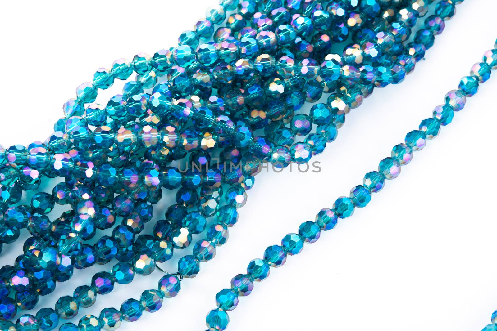 Beautiful emerald Glass Sparkle Crystal Isoalted Beads on white background. Use for diy beaded jewelry. Space for text