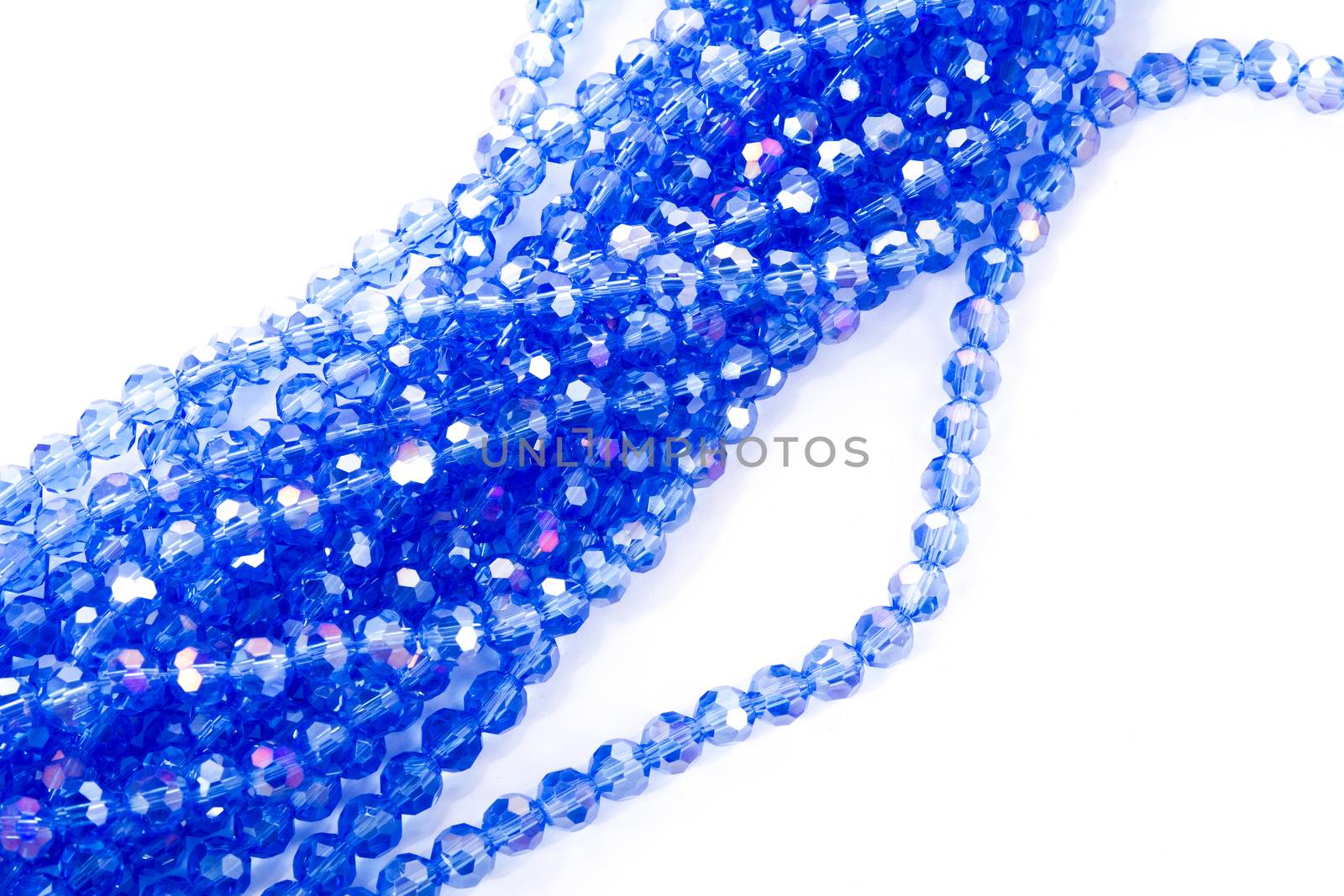 Beautiful blue Glass Sparkle Crystal Isoalted Beads on white background. Use for diy beaded jewelry. Space for text