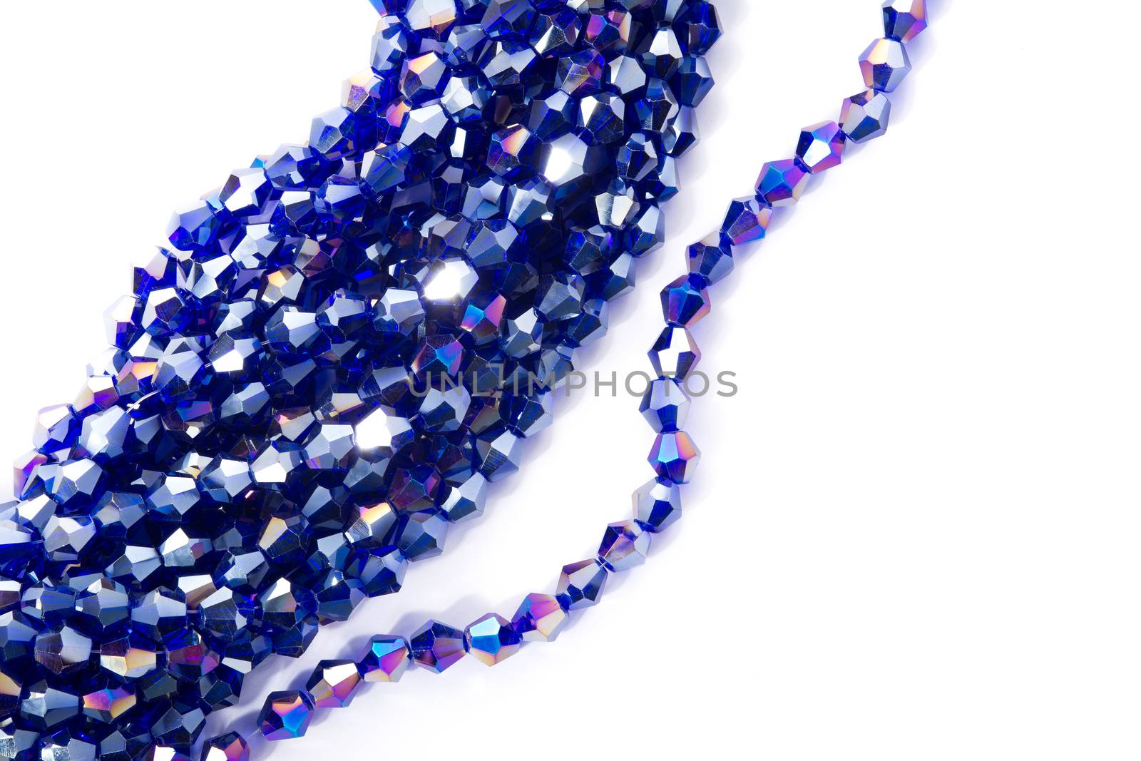 Beautiful blue Glass Sparkle Crystal Isoalted Beads on white background. Use for diy beaded jewelry. Space for text