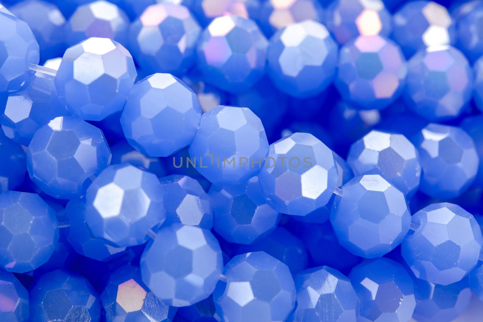 Beautiful blue Glass Sparkle Crystal Isoalted Beads on white background. Use for diy beaded jewelry. Space for text