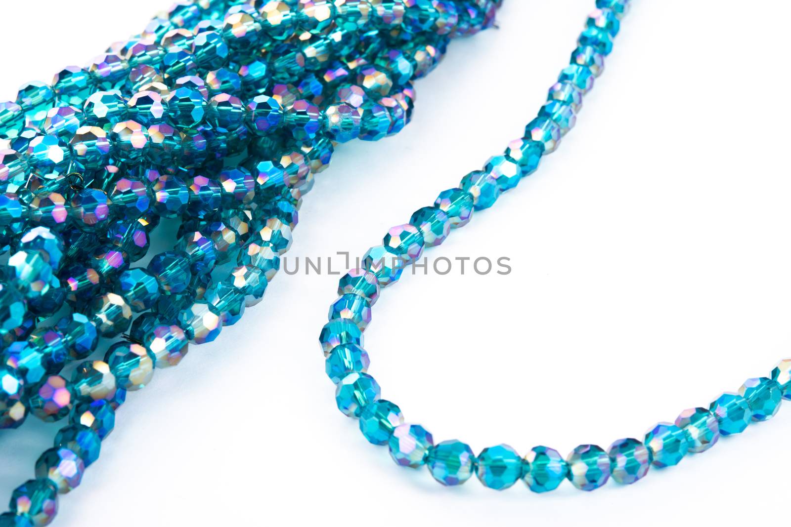 Beautiful emerald Glass Sparkle Crystal Isoalted Beads on white background. Use for diy beaded jewelry. Space for text