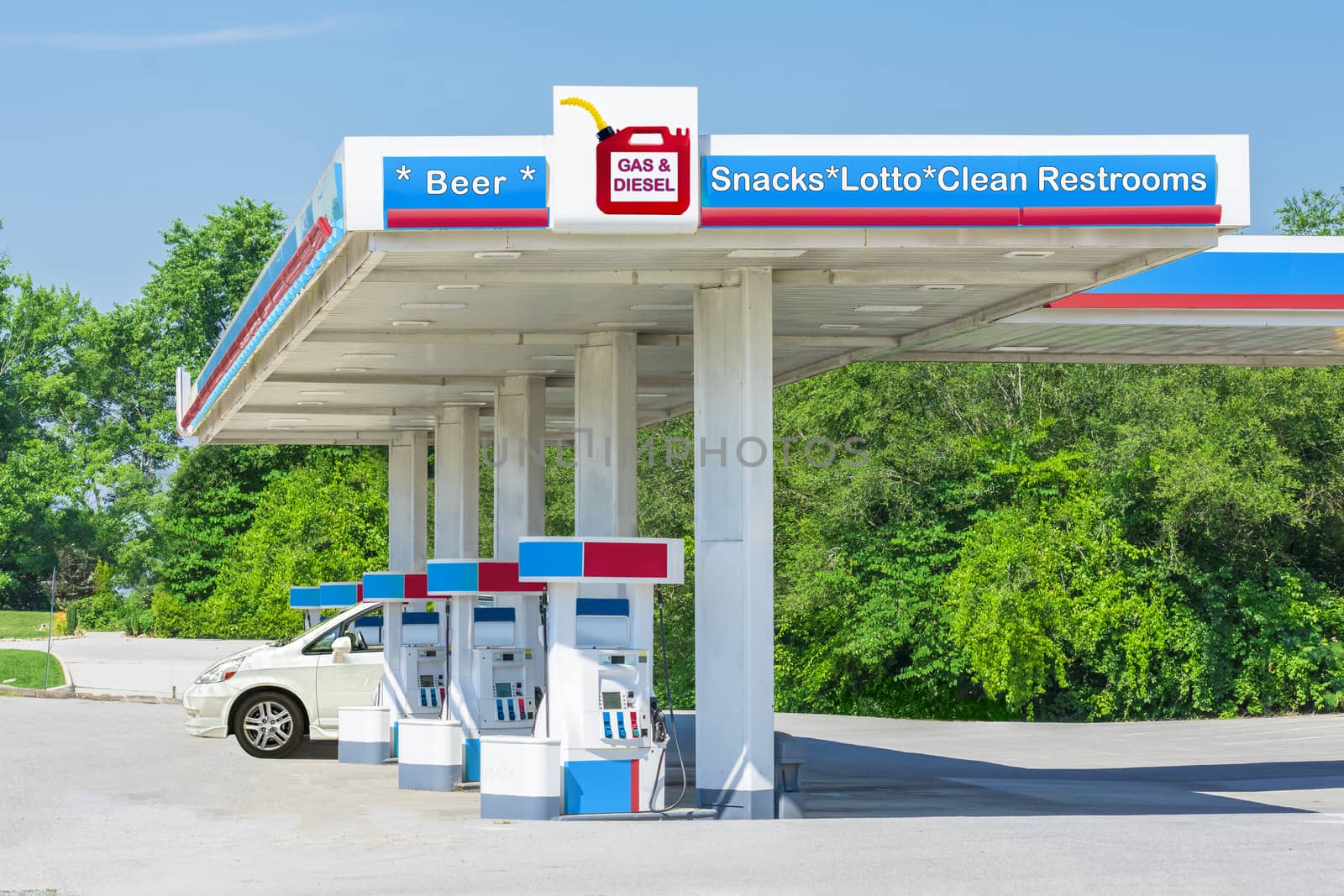 Horizontal shot of an unlabeled gas station convenience store with photographer created signage.