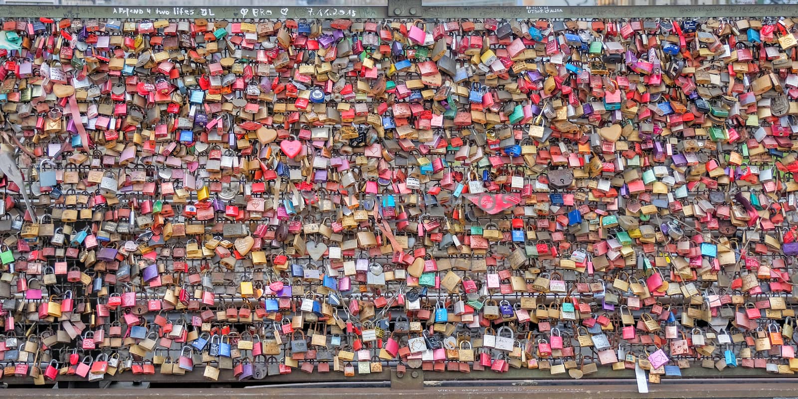 COLOGNE, GERMANY - MARCH 26: One of the main tourist attractions is the colorful love padlocks across the Hohenzollern Bridge on March 26, 2017 in Cologne.Germany