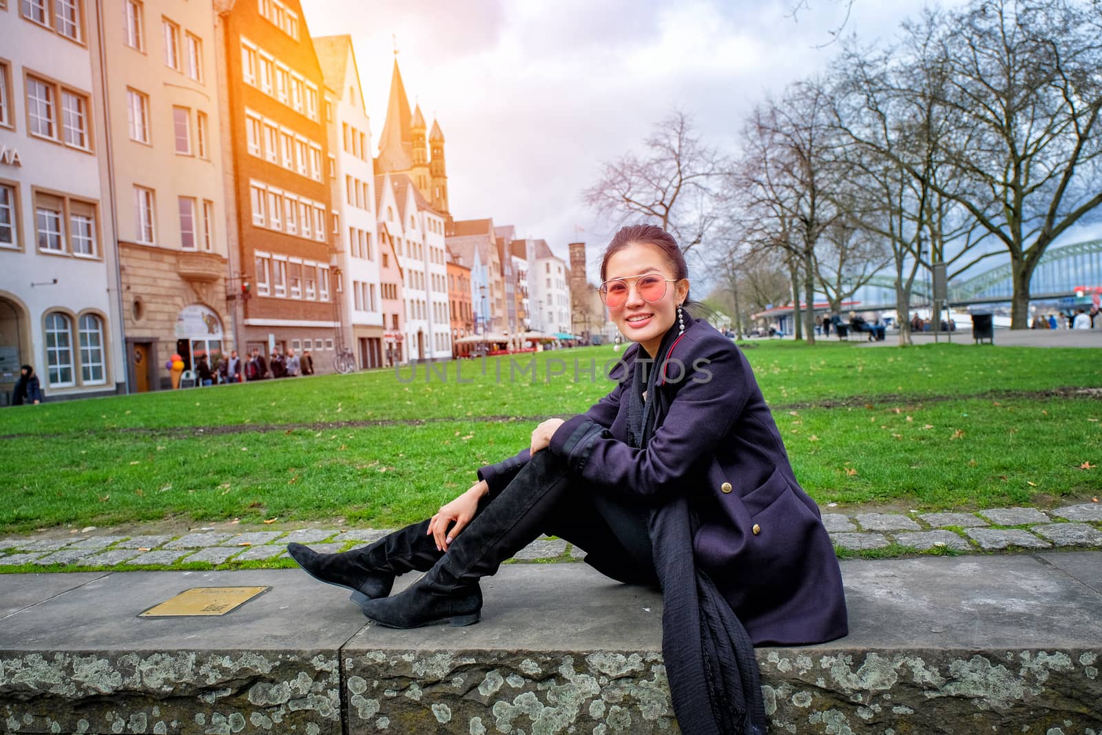 Yound beautiful woman sitting in frankfurt Market, Germany by Surasak