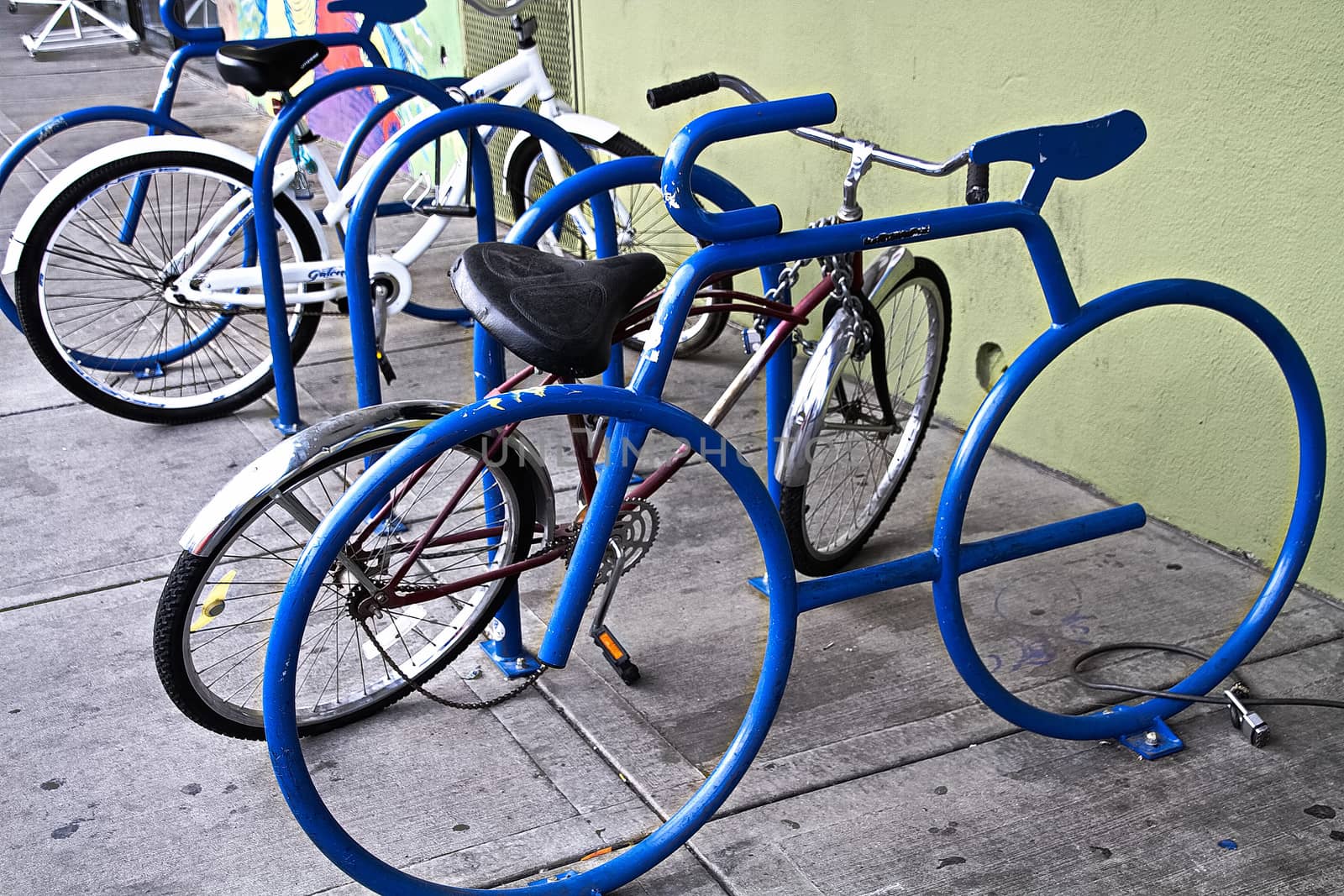 A bike parking opportunity with a symbol.bike parking Bicycle racks in bicycle parking facility Modern bike storage in the form of a steel spiral Bicycle parking. by USA-TARO