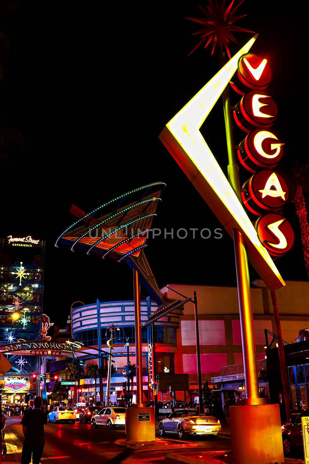 Las Vegas,NV/USA - Oct 09,2016 : "Oscar's Neon Martini Glass"  and Vegas giant neon sign on display above the street near Fremont Street Experience in Las Vegas.The Fremont Street Experience is a pedestrian mall and attraction in downtown Las Vegas. by USA-TARO
