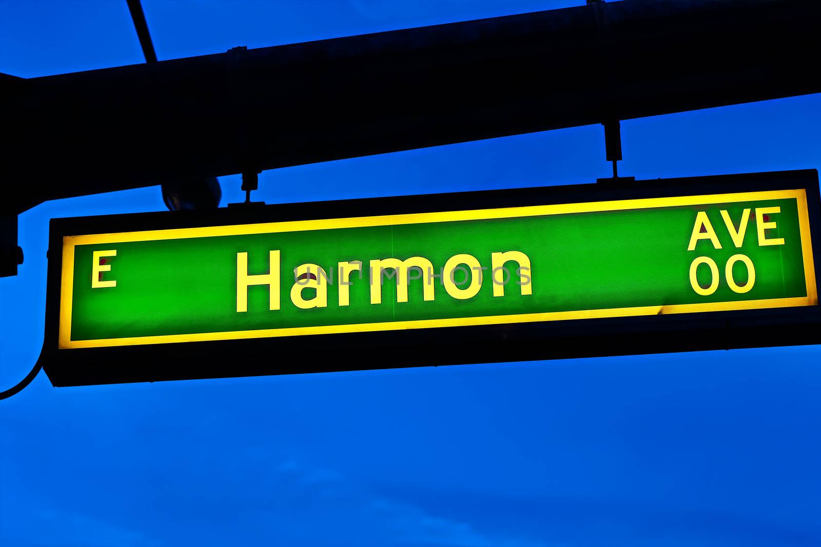 Road sign of Harmon Avenue.Street sign of Harmon Avenue.Green Harmon Avenue Sign with blue sky Background.