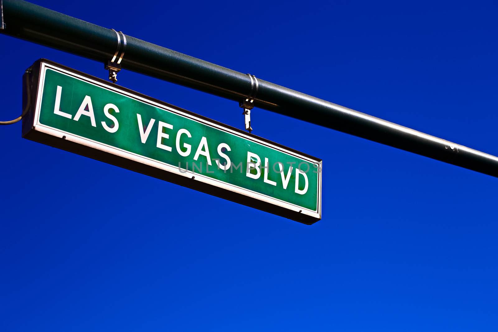 Road sign of Las Vegas BLVD.Street sign of Las Vegas Boulevard.Green Las Vegas Sign with blue sky Background. by USA-TARO