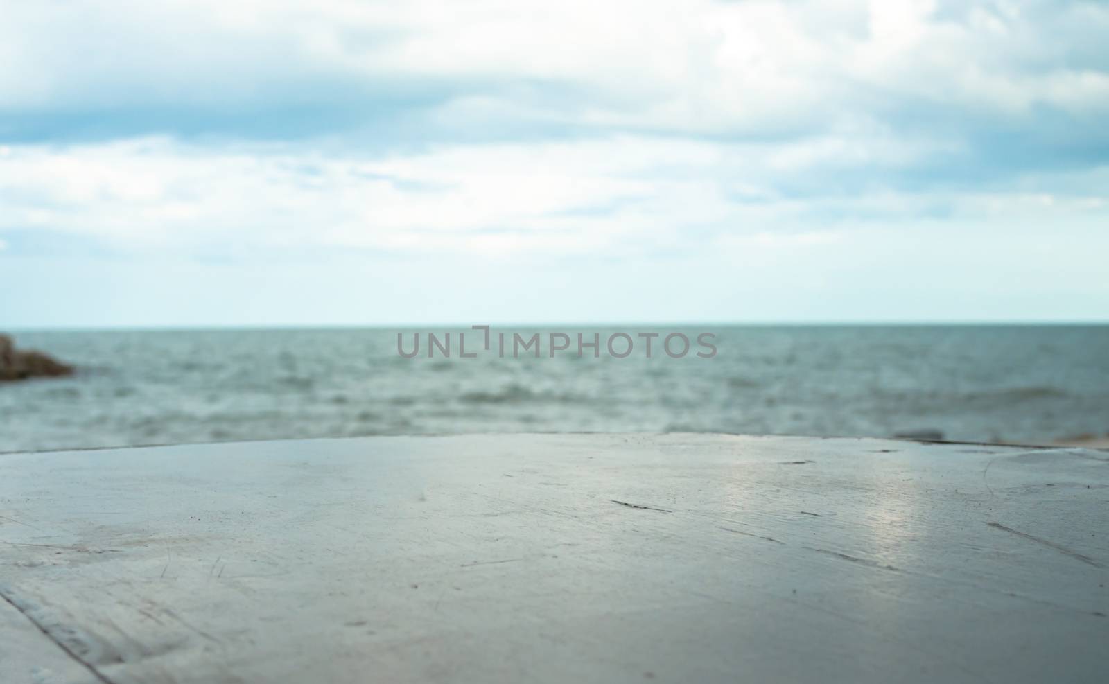 Empty stone floor On a blurred sea background by Unimages2527