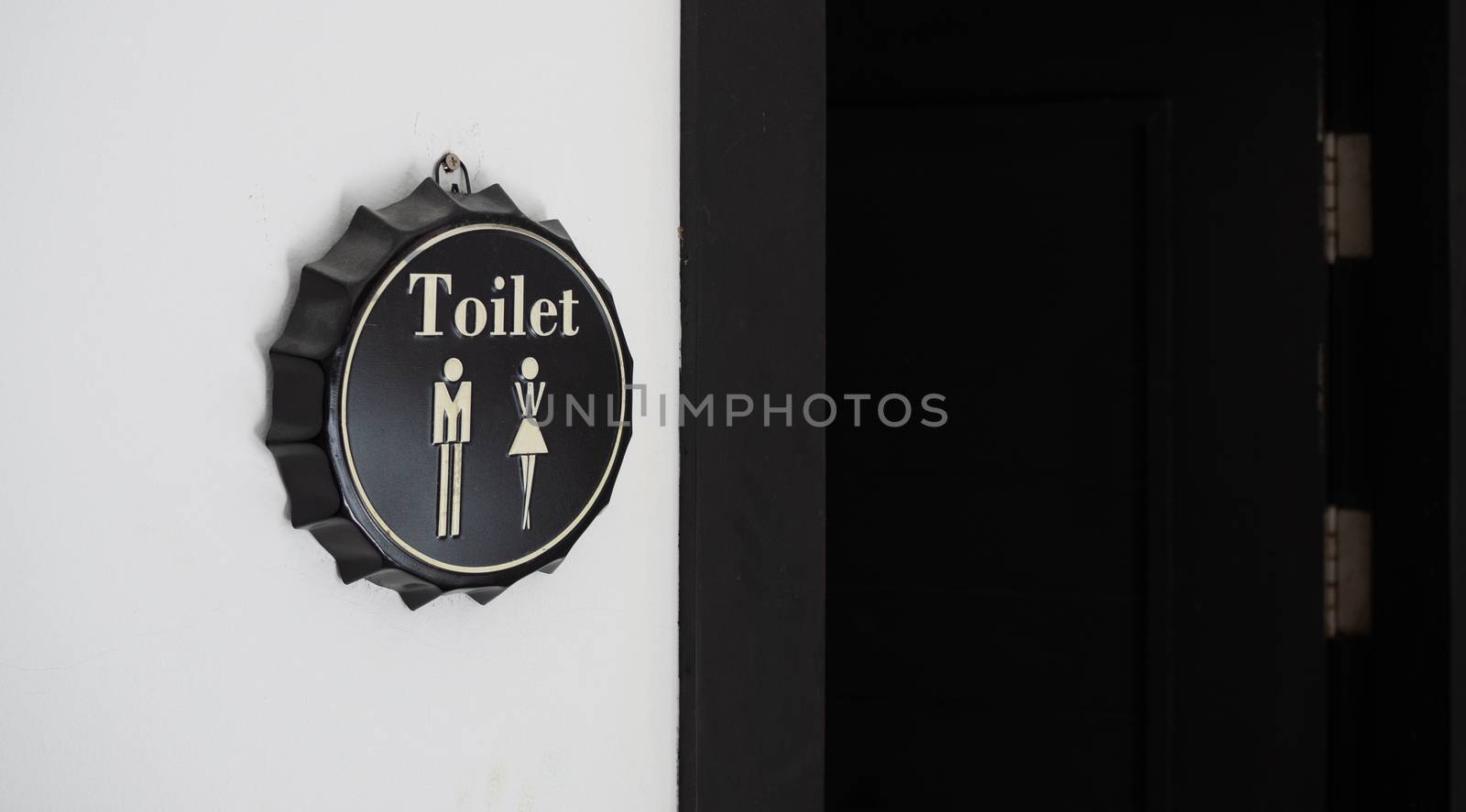 Male and female toilet sign. by Unimages2527