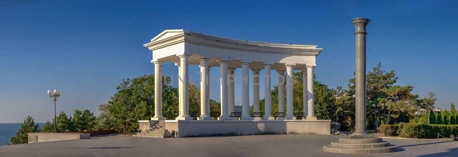 Chernomorsk, Ukraine 08.22.2020. Colonnade and Obelisk of Glory in Chernomorsk city on a sunny summer morning