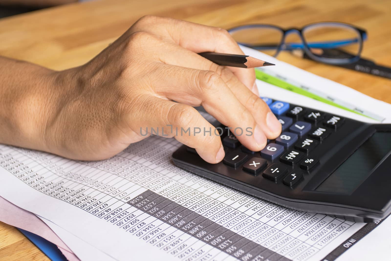 Hand of man use calculators concept Calculating expenses 
