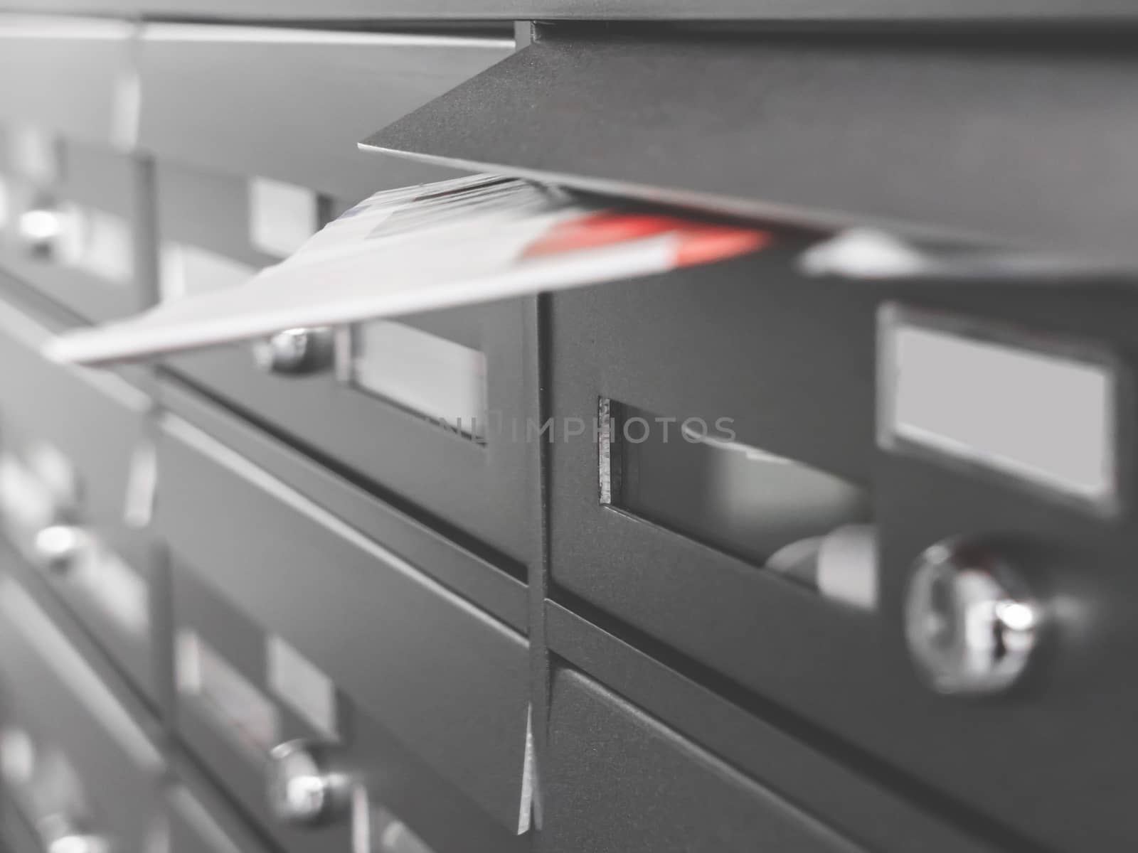 Modern metal mailboxes in an apartment building. Selective focus.