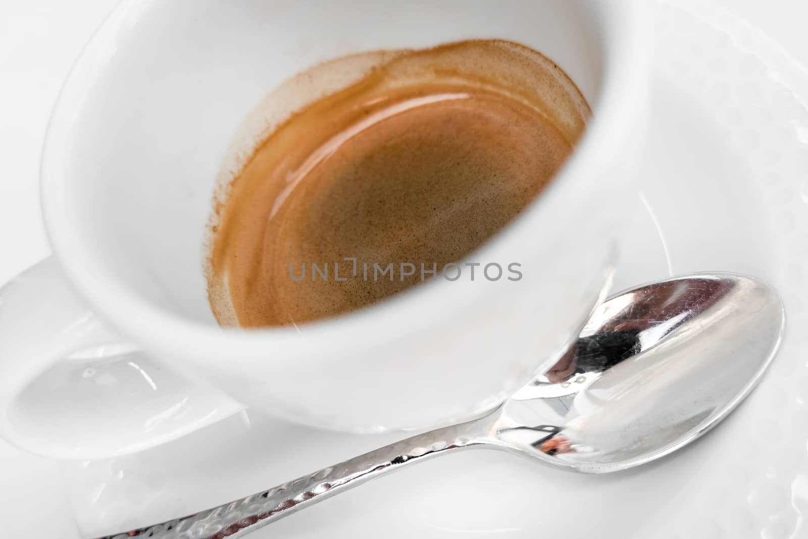 Italian cup of coffee. Cup of hot espresso. Extreme close-up with selective focus. Defocused blurry background.