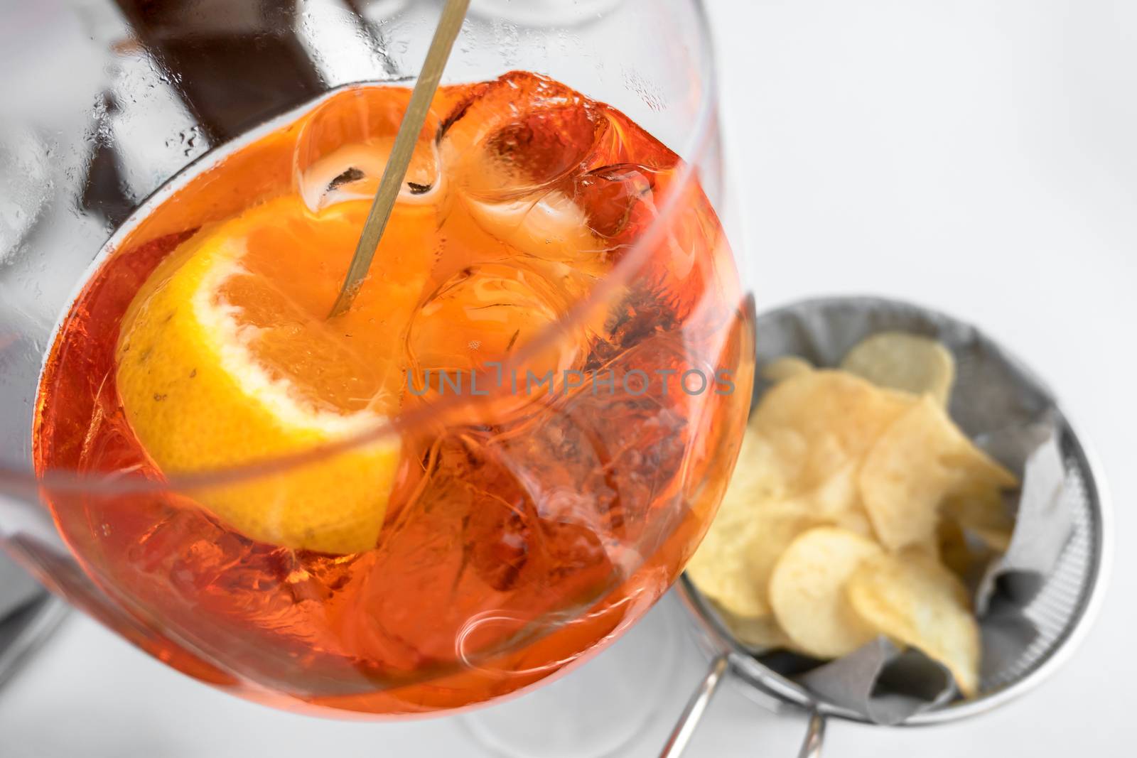Classic italian spritz cocktail with chips. Copy space.