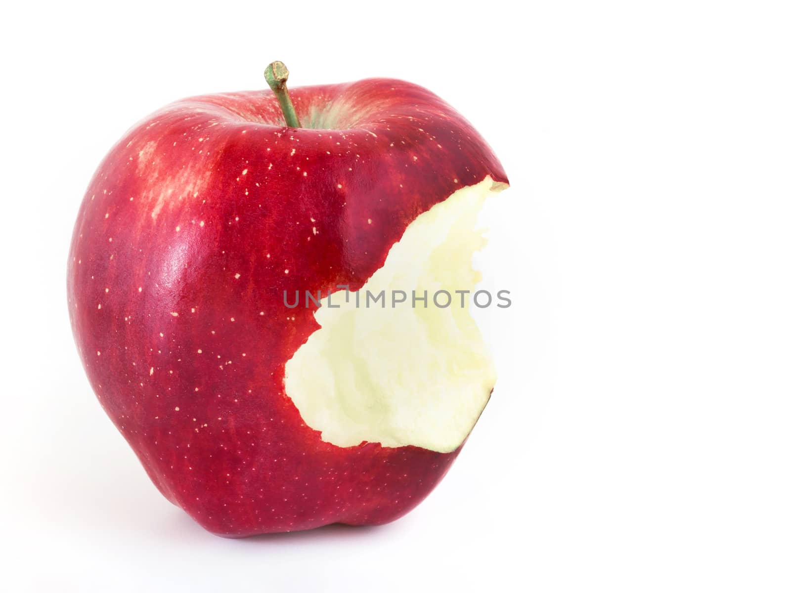 Red bitten apple on white background. Copy-space.