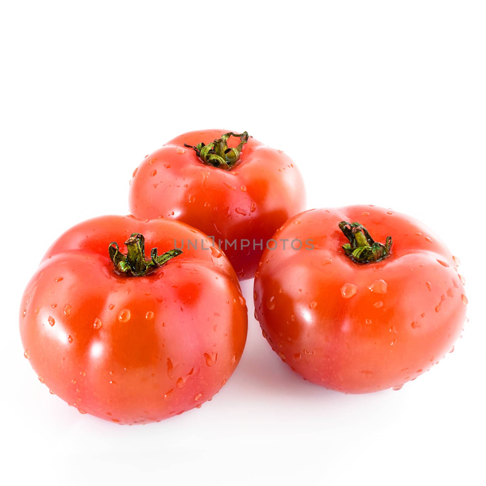 Fresh three tomatoes by germanopoli