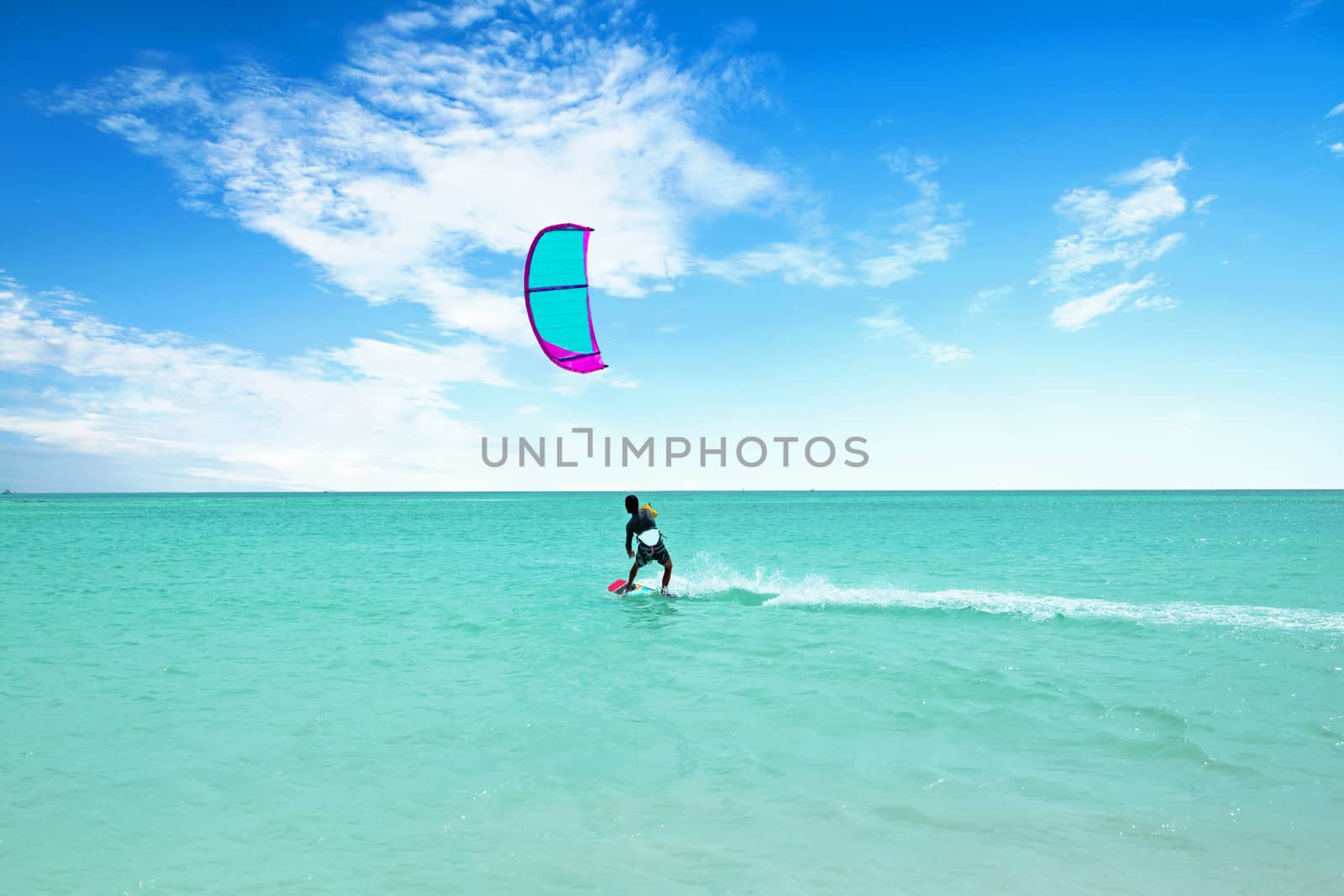 Kite surfing at Palm Beach on Aruba island in the Caribbean Sea