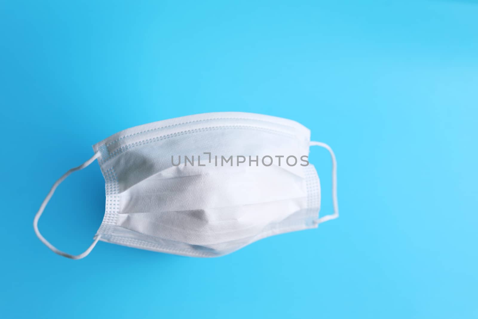 Protection mask filter on blue background