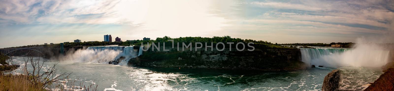 Niagara falls Canada: of an aerial panormal of the falls and the city of Niagara. Niagara is one of Canadas most popular tourist destinations and has been hit hard by covid. by mynewturtle1