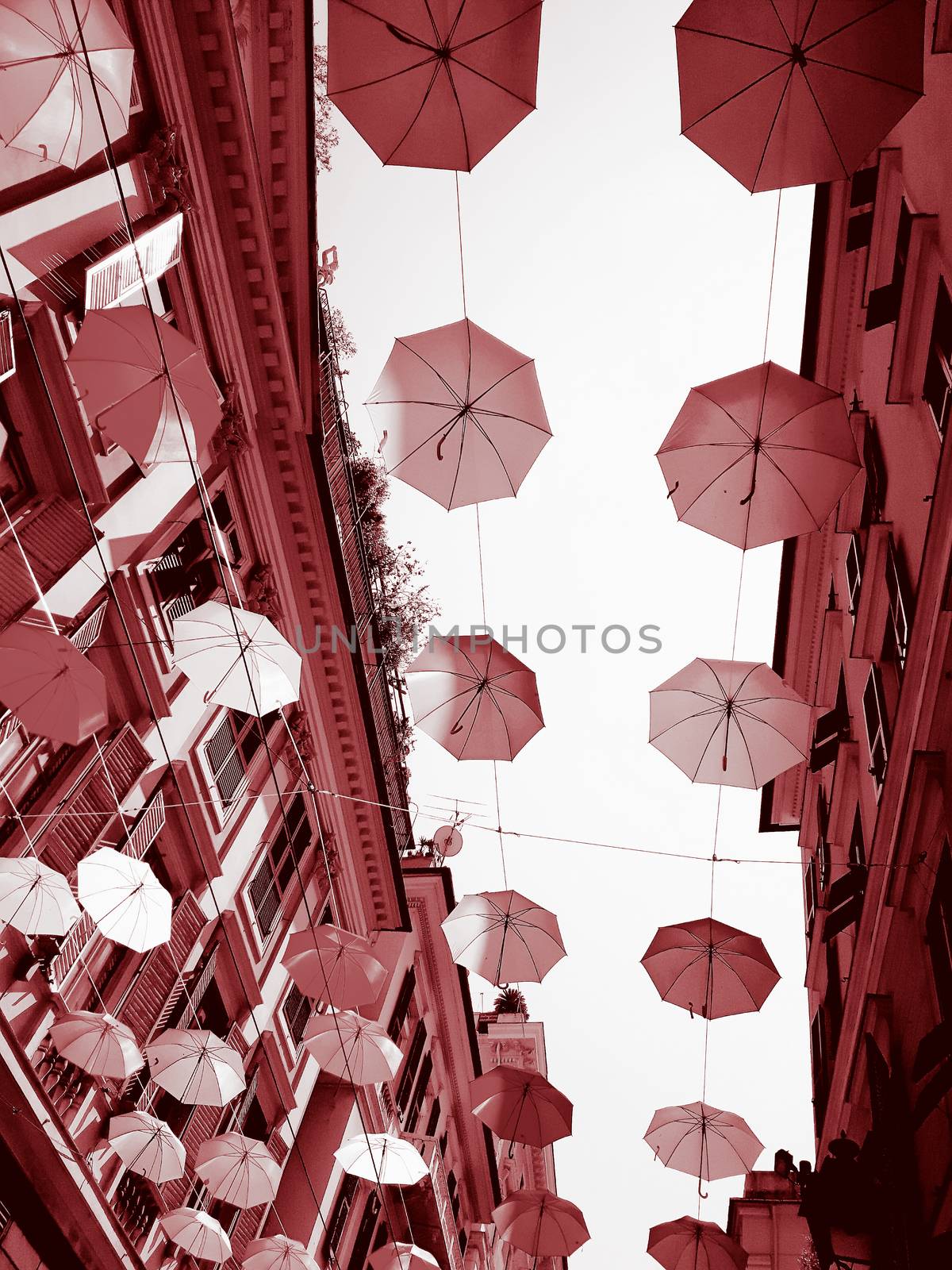 Coloured umbrellas over the city by yohananegusse