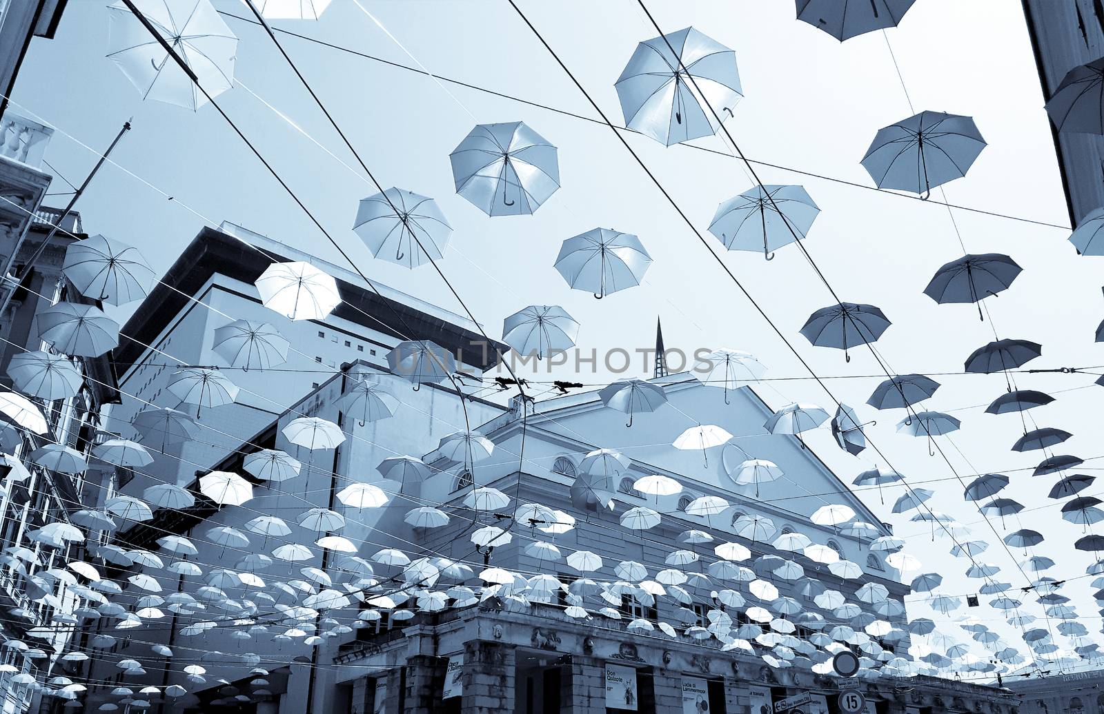 Coloured umbrellas over the city by yohananegusse