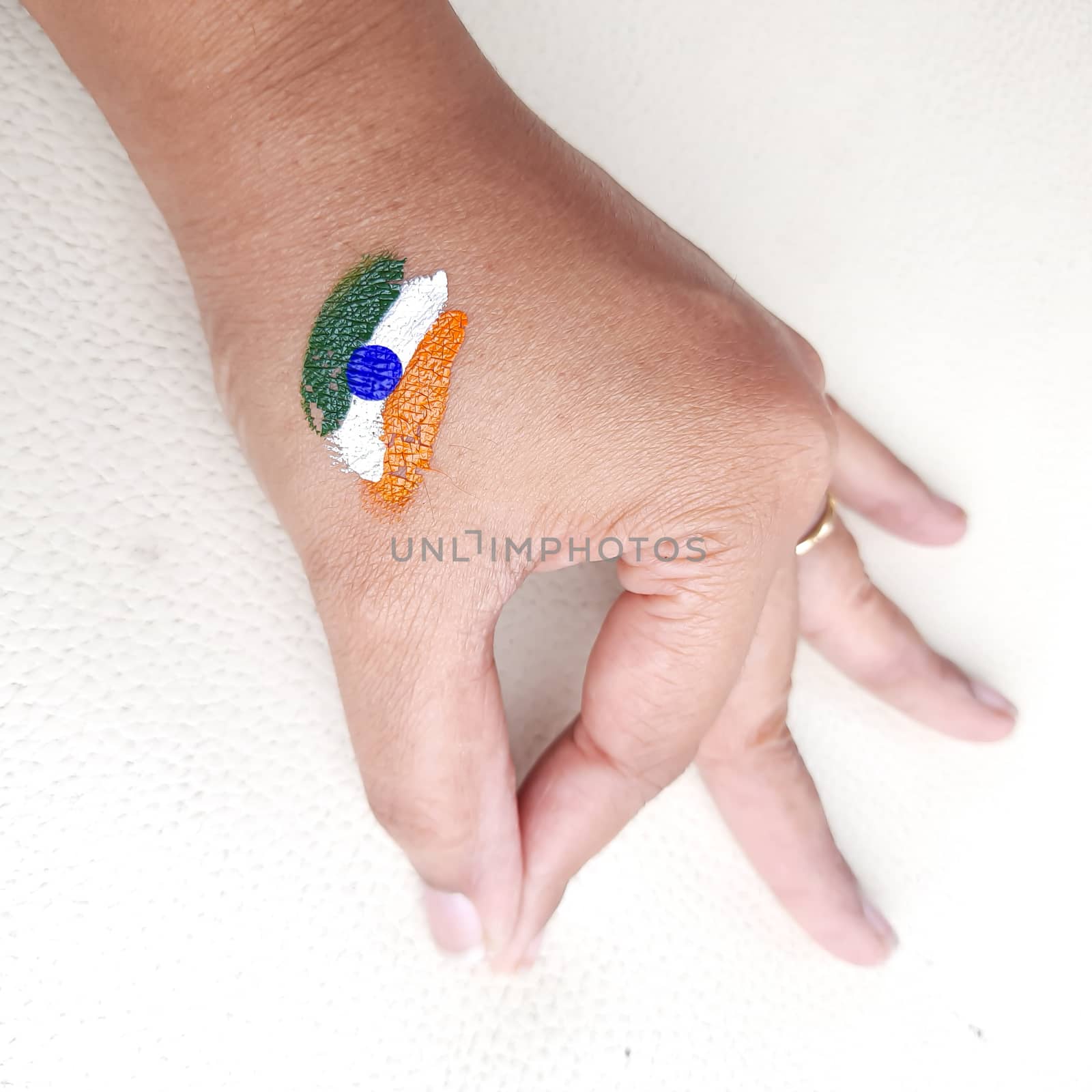 Indian flag painted in hand for independence day celebration