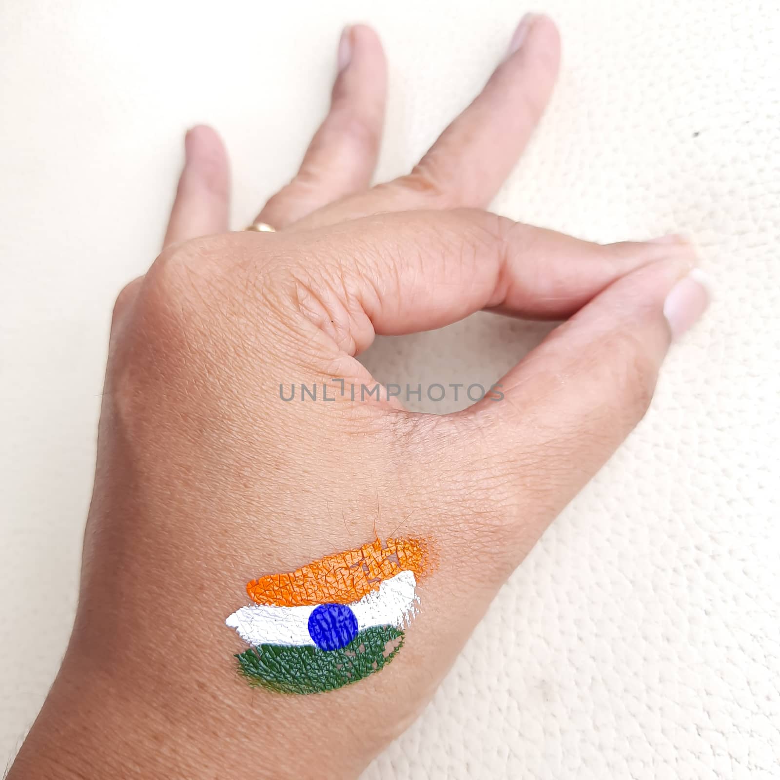 Indian flag painted in hand for independence day celebration