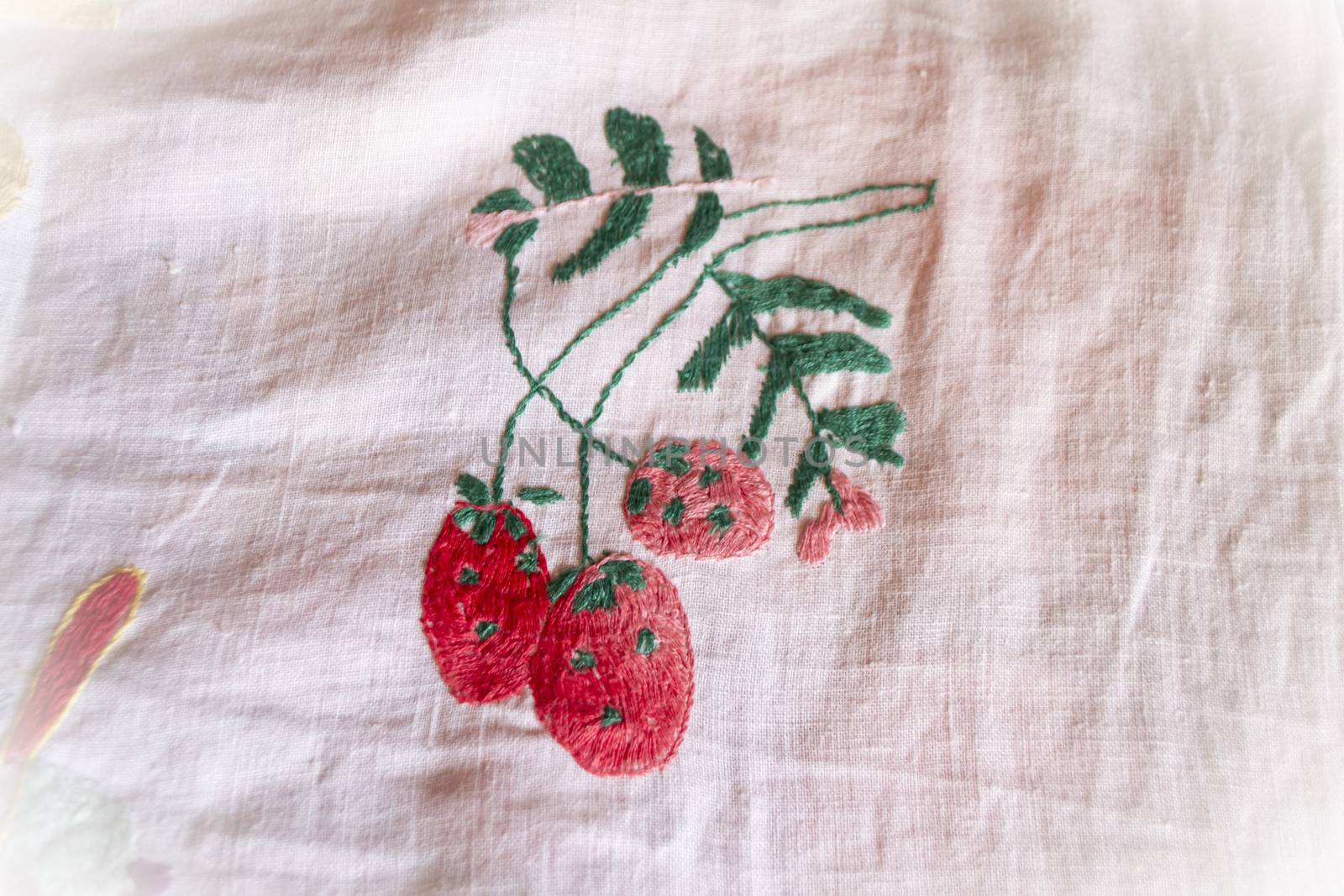 hand made embroidered smooth berry decoration on white fabric , vintage folk embroidery in Belarus, second half of 19 century