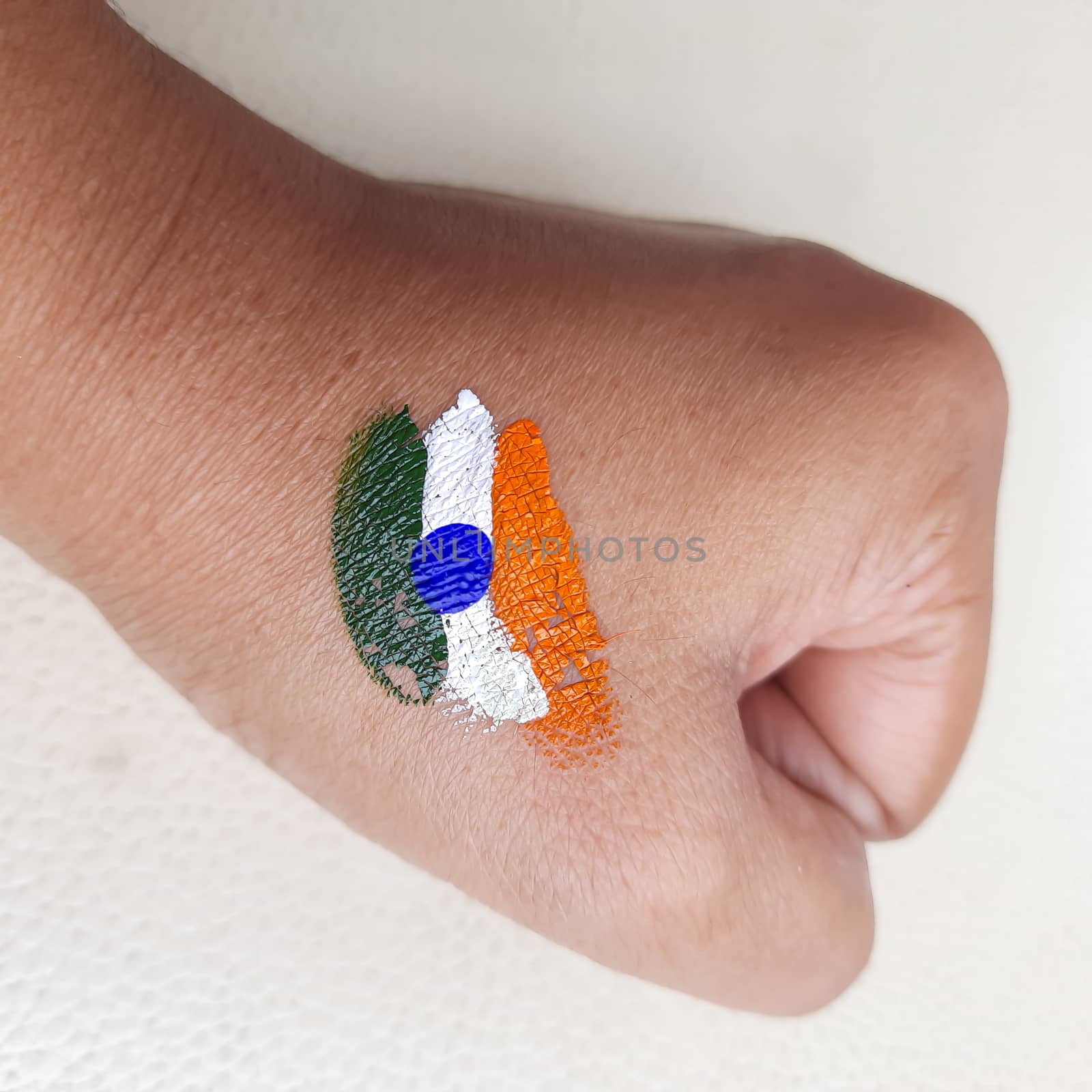 Indian flag painted in hand for independence day celebration