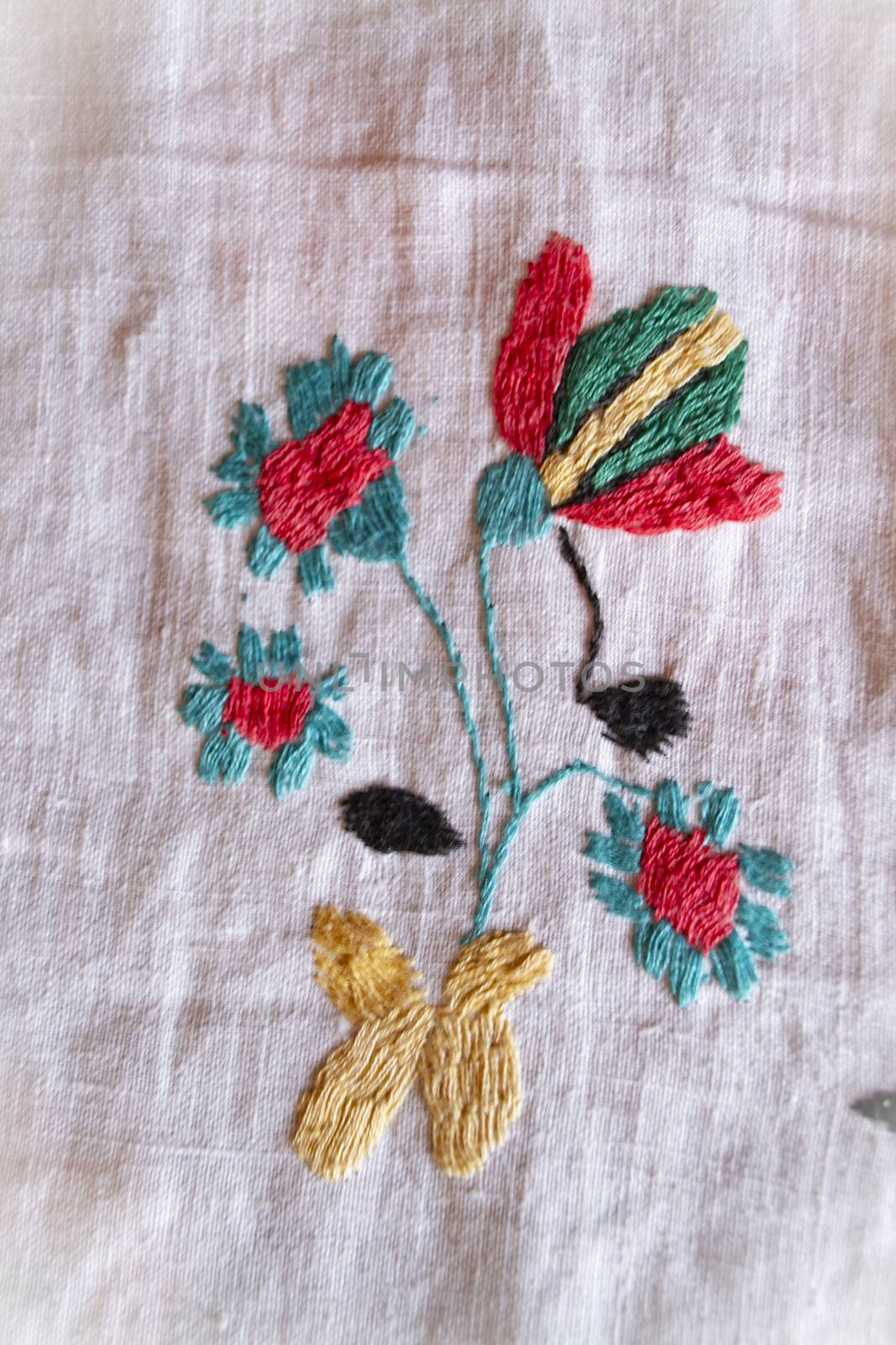 poppy hand made embroidered smooth decoration on white fabric , vintage folk embroidery in Belarus, second half of 19 century