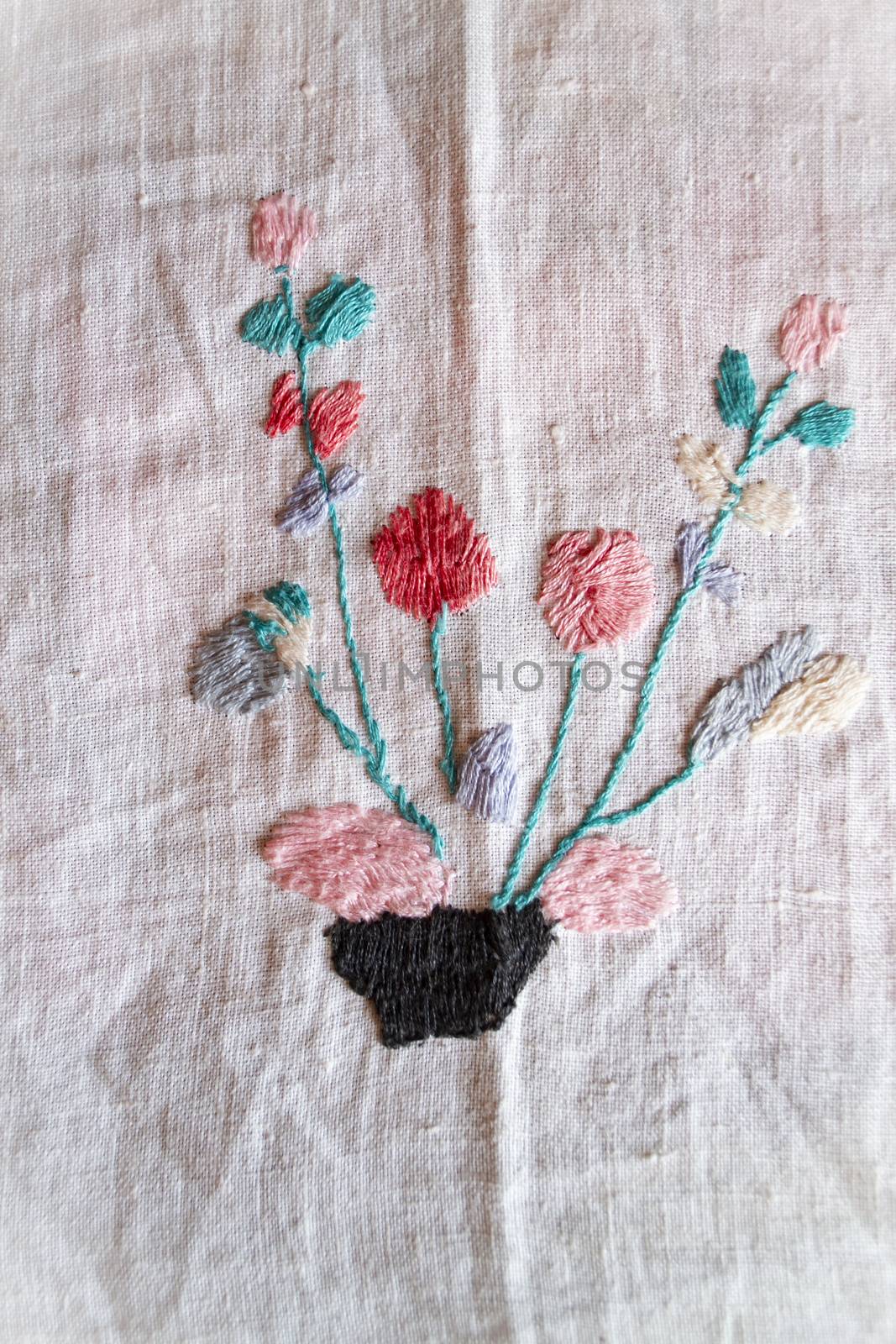 red flowers hand made embroidered smooth decoration on white fabric , vintage folk embroidery in Belarus, second half of 19 century