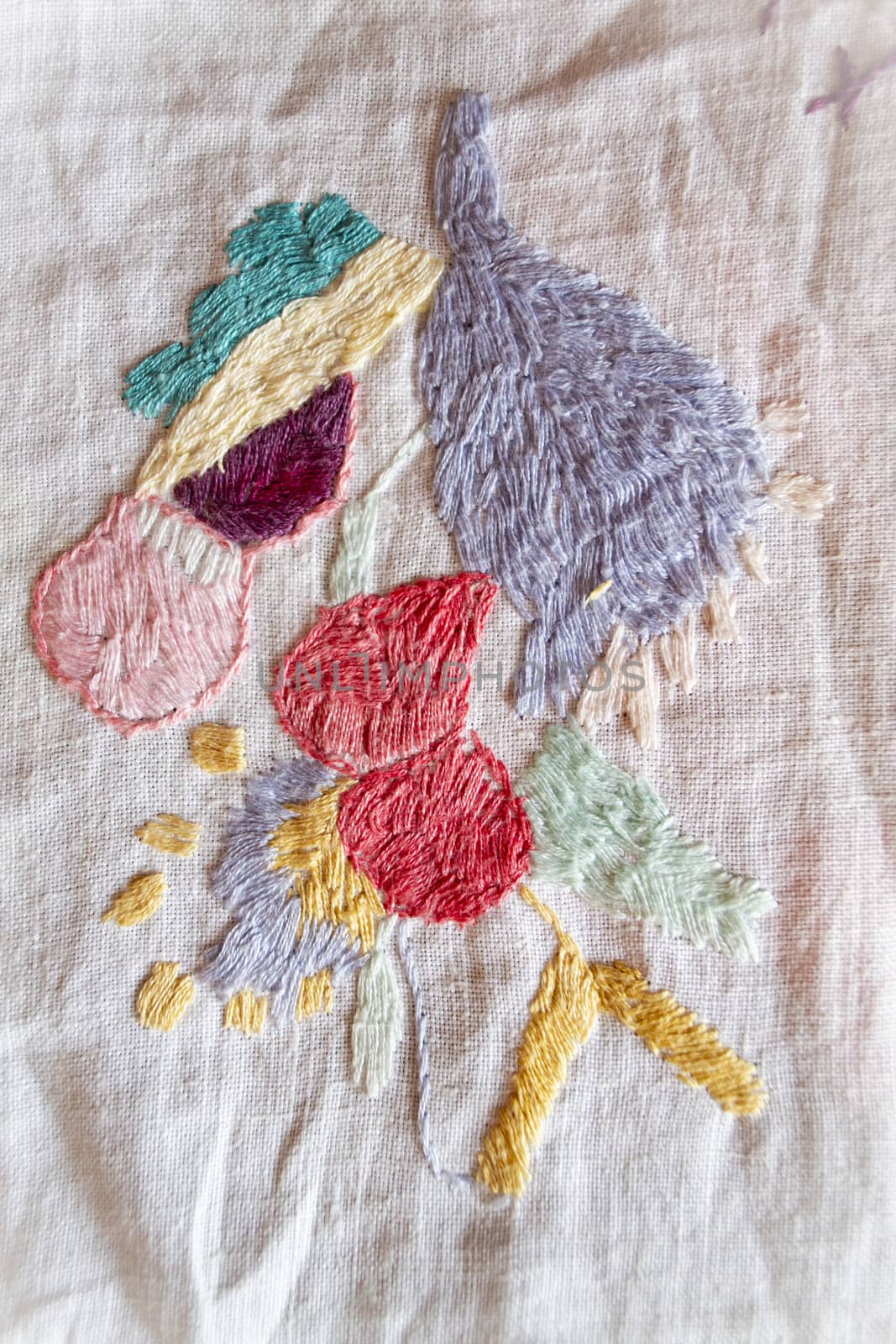 colorful hand made embroidered smooth decoration on white fabric , vintage folk embroidery in Belarus, second half of 19 century