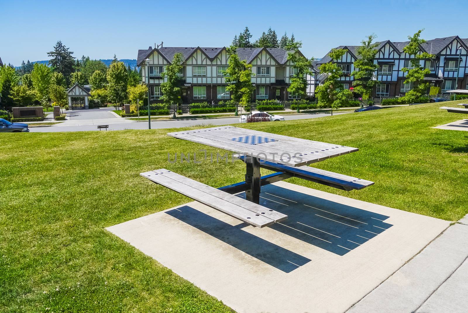 Recreation area with chess table on the block of new townhouses
