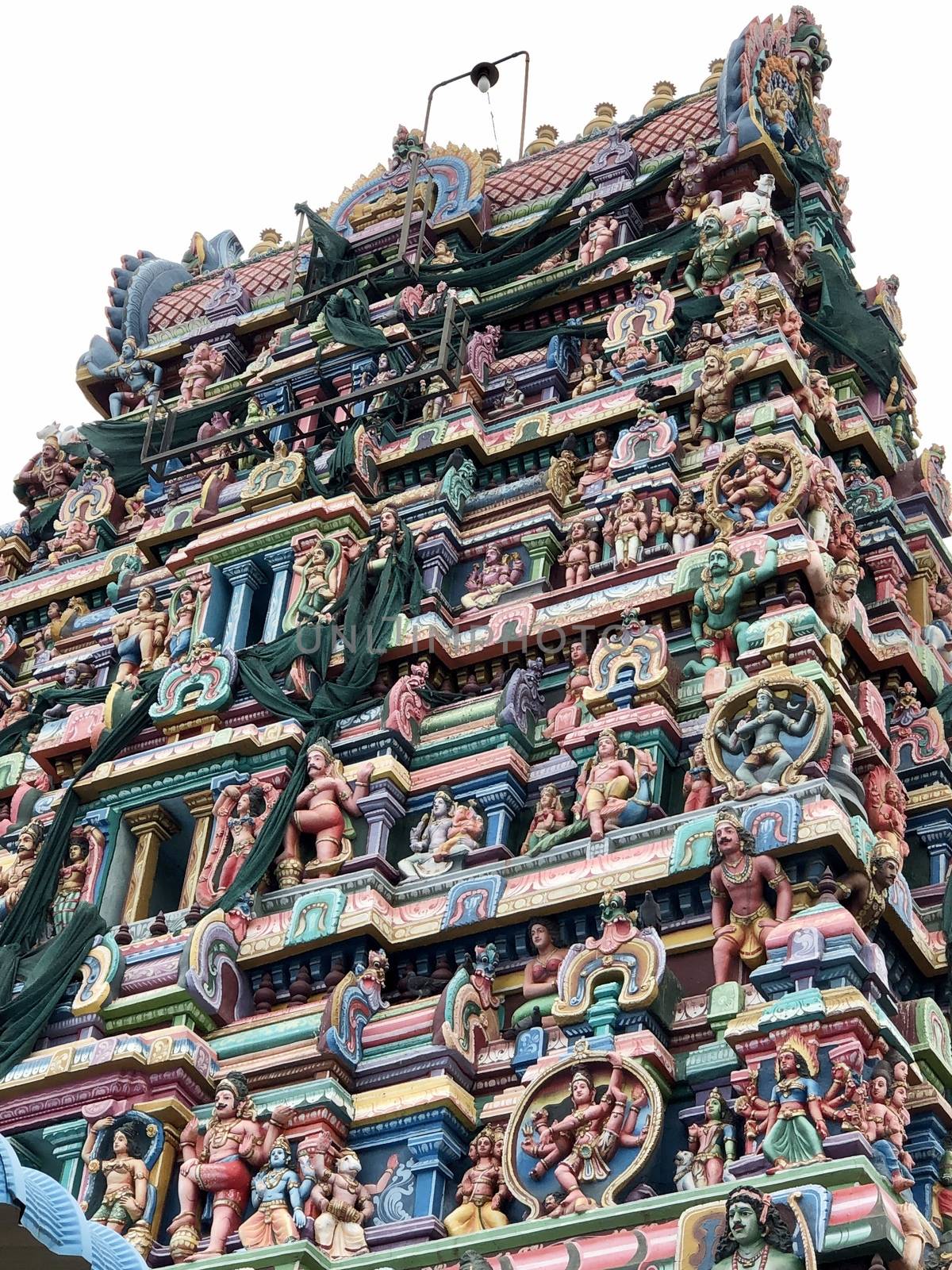 Temple with beautiful goupuram and sculptures in it with clear sky background